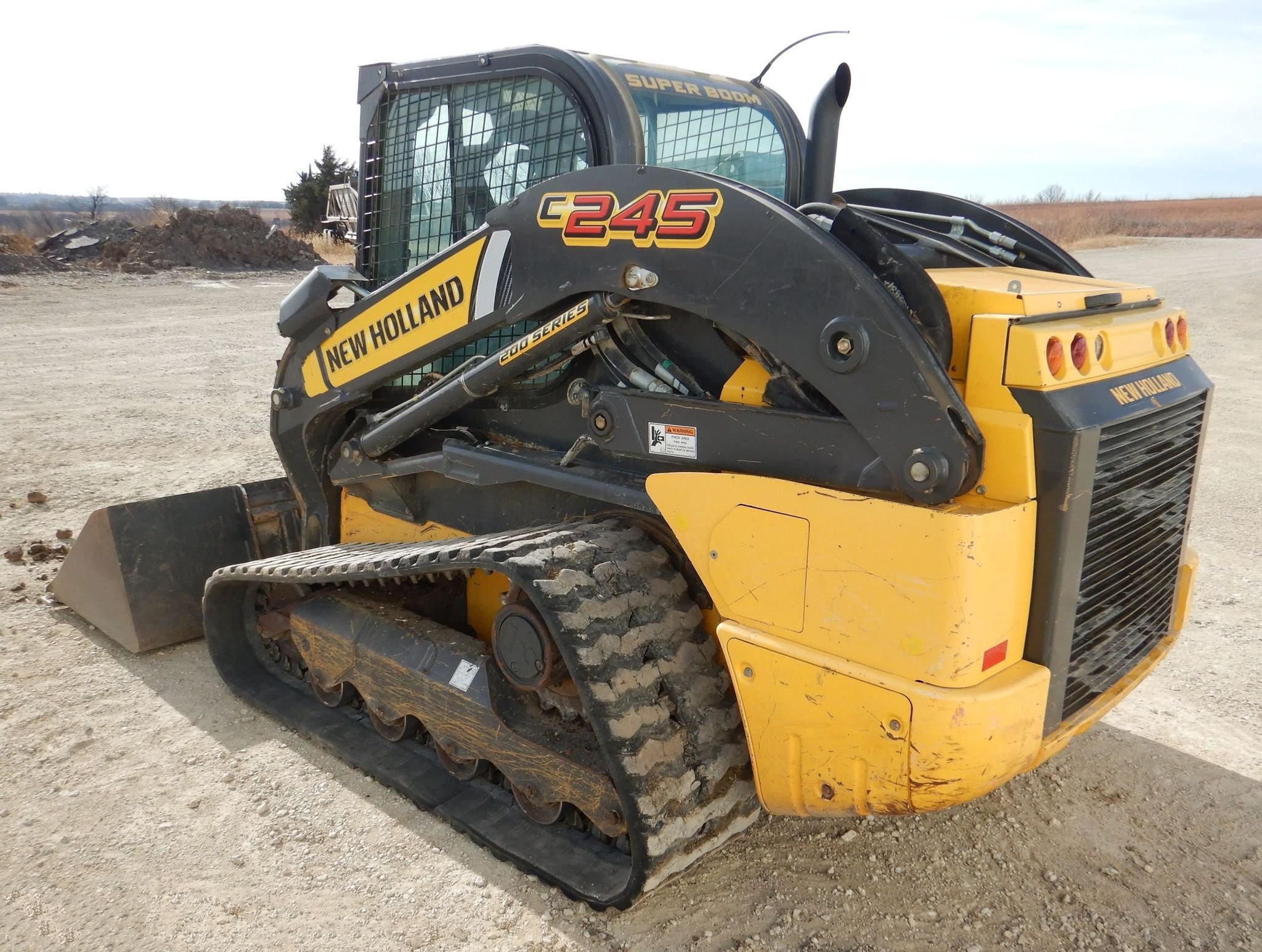 gallery New Holland C245 tracked skid steer loader