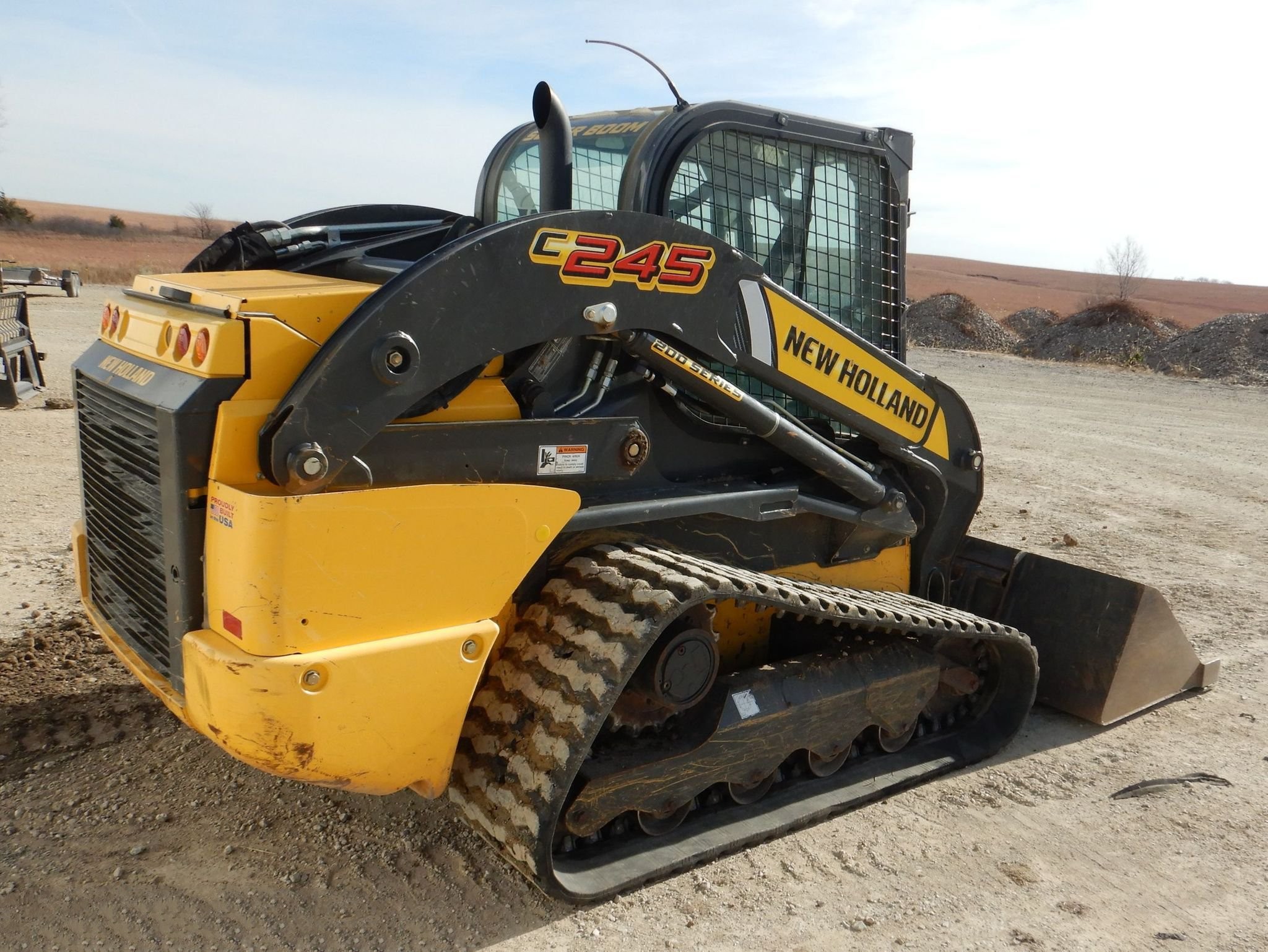 gallery New Holland C245 tracked skid steer loader