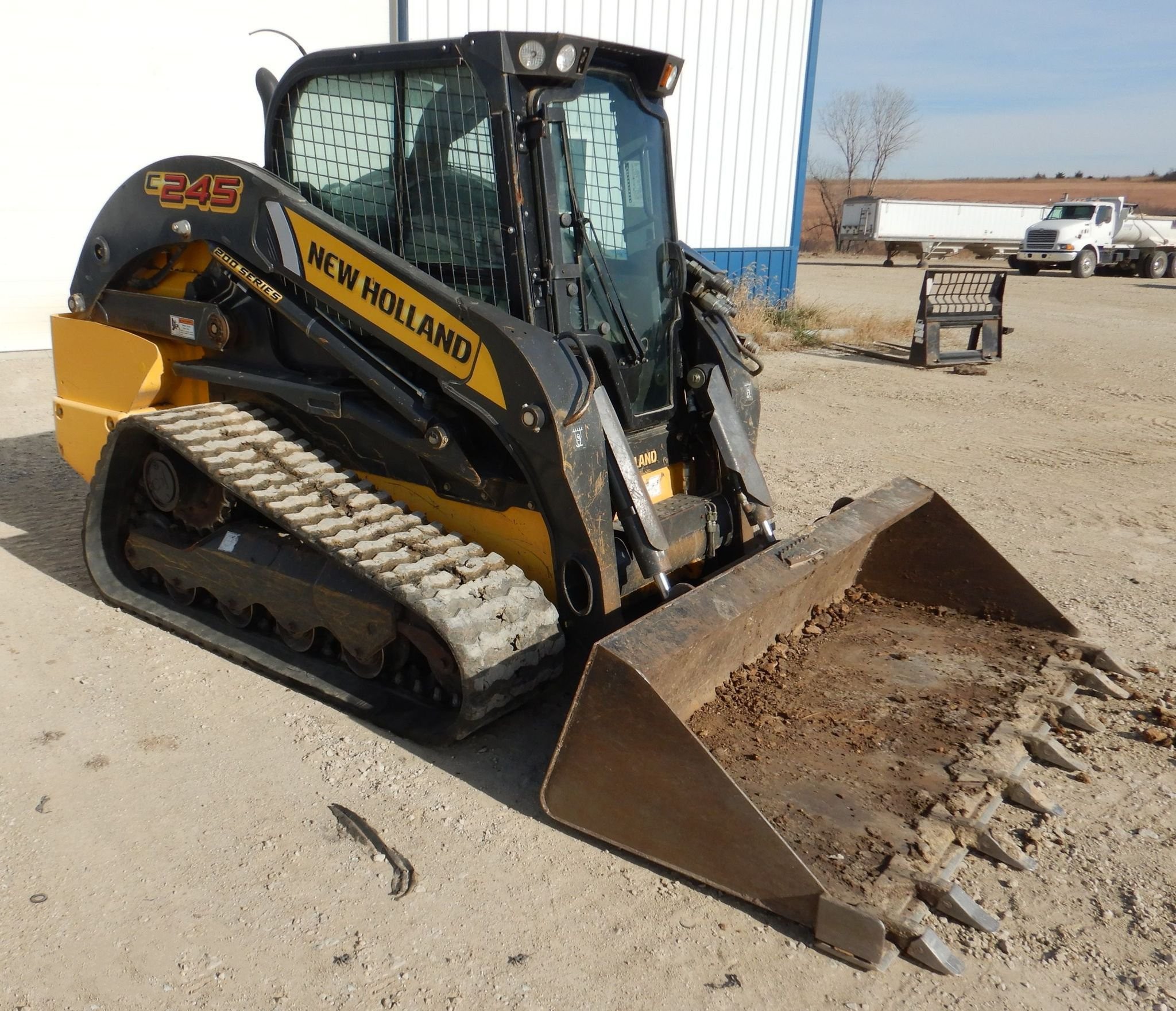gallery New Holland C245 tracked skid steer loader