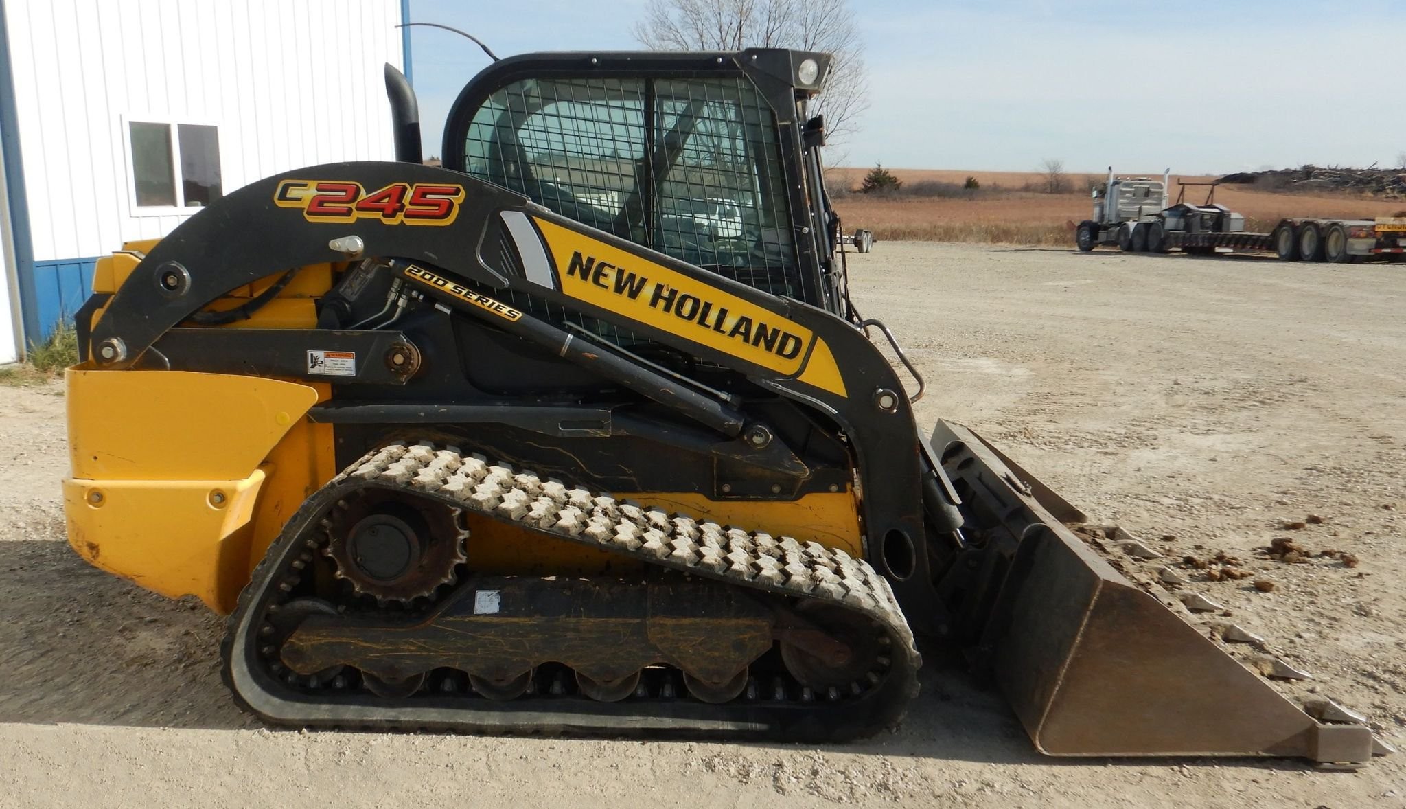 gallery New Holland C245 tracked skid steer loader