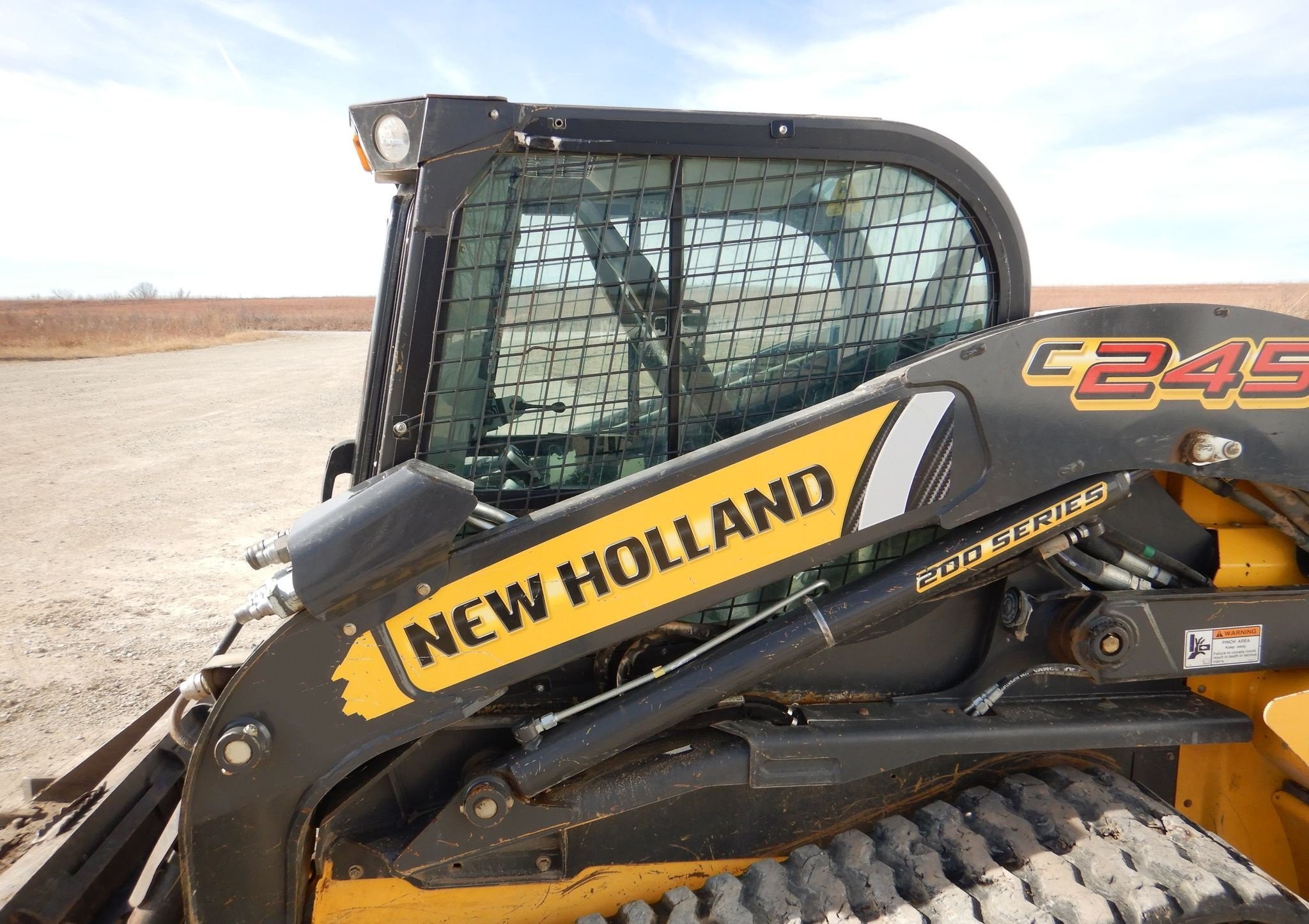 gallery New Holland C245 tracked skid steer loader
