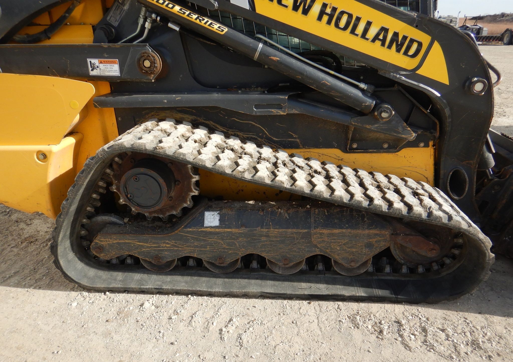 gallery New Holland C245 tracked skid steer loader