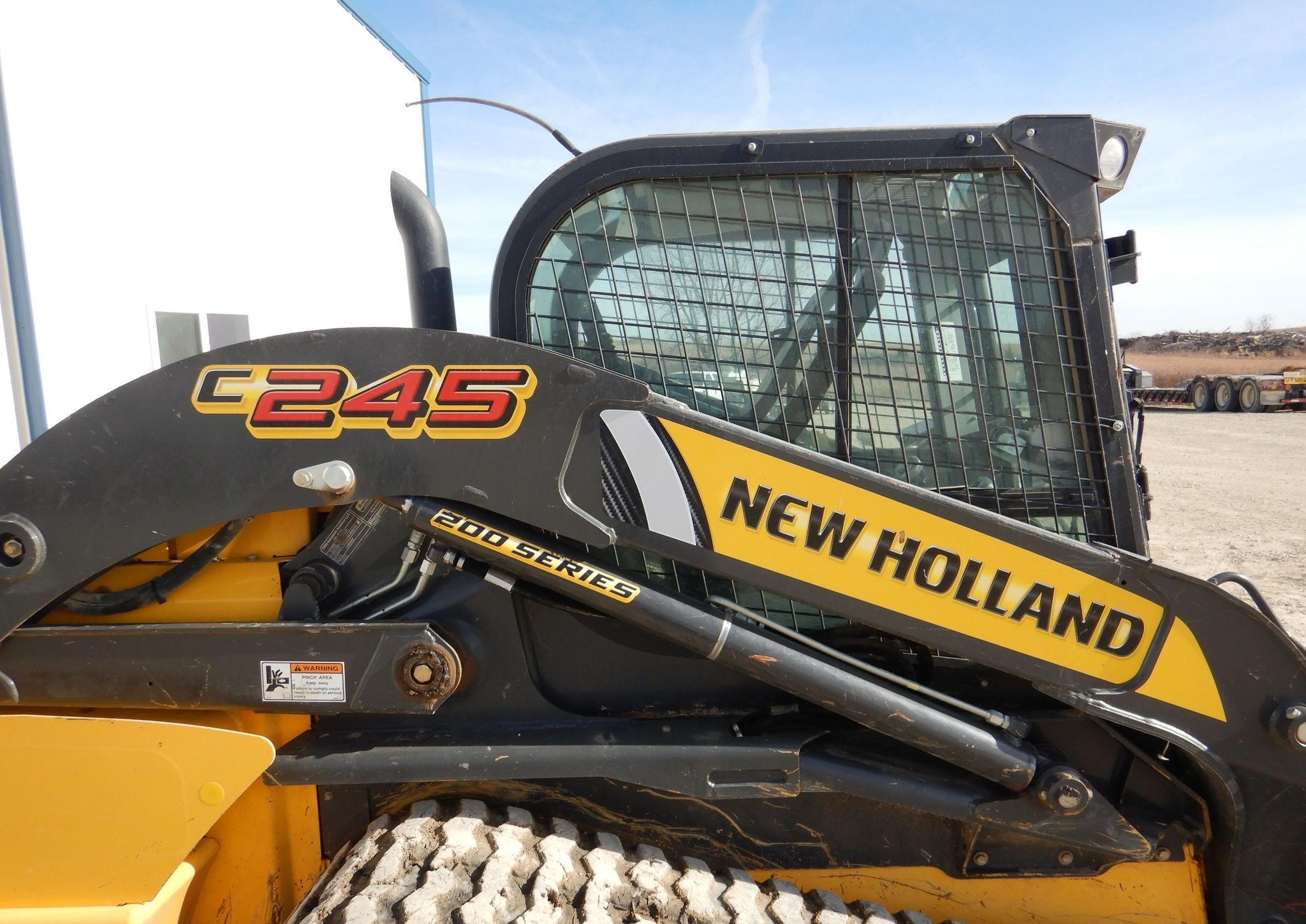 gallery New Holland C245 tracked skid steer loader