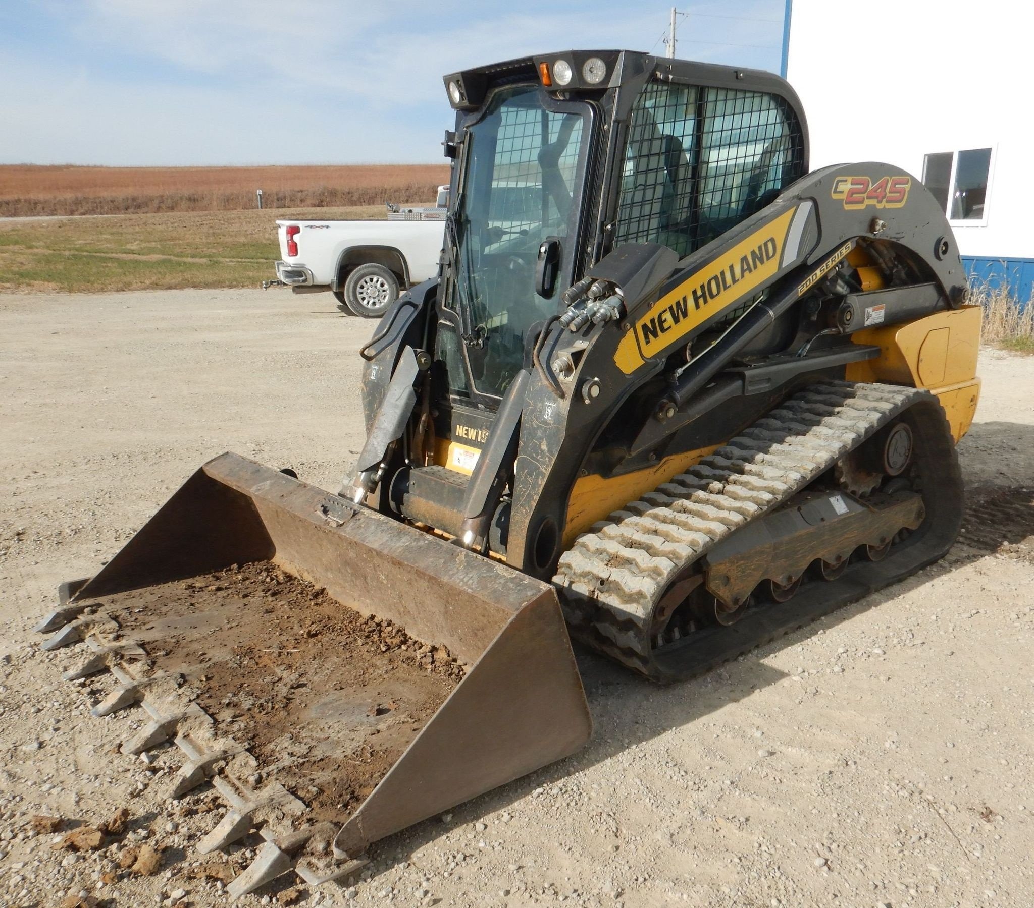 gallery New Holland C245 tracked skid steer loader